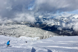 A skier skiing the powder snow in a private lesson down to La Tania