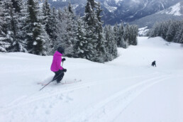 Skiing down the Jockeys piste to Le Praz Courchevel with a guide in fresh snow